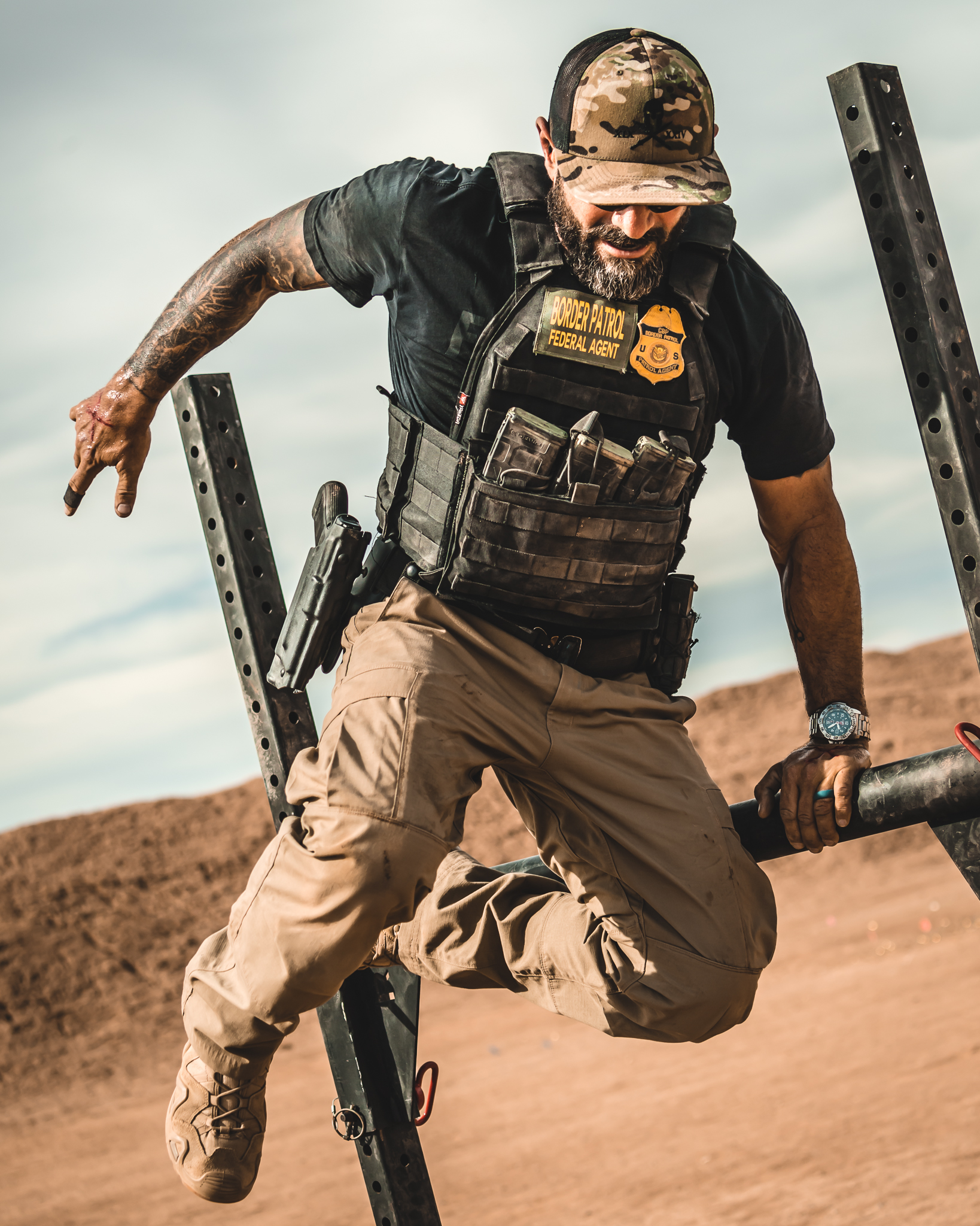 Tactical athlete navigating an obstacle under load